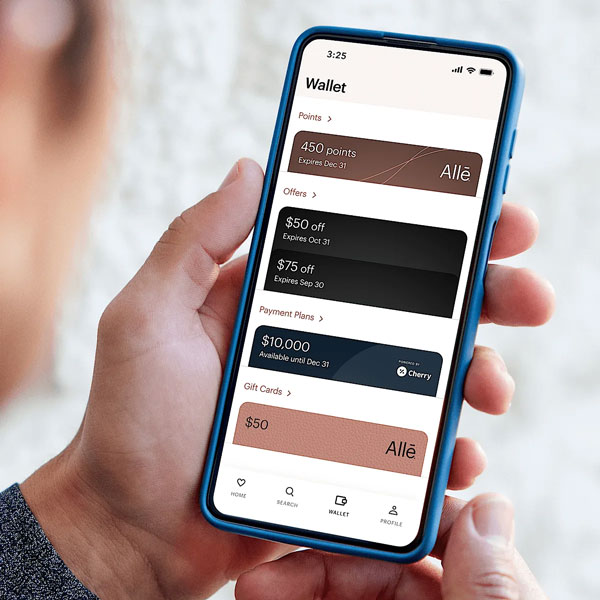 hand holding phone with Alle Rewards app open to dashboard