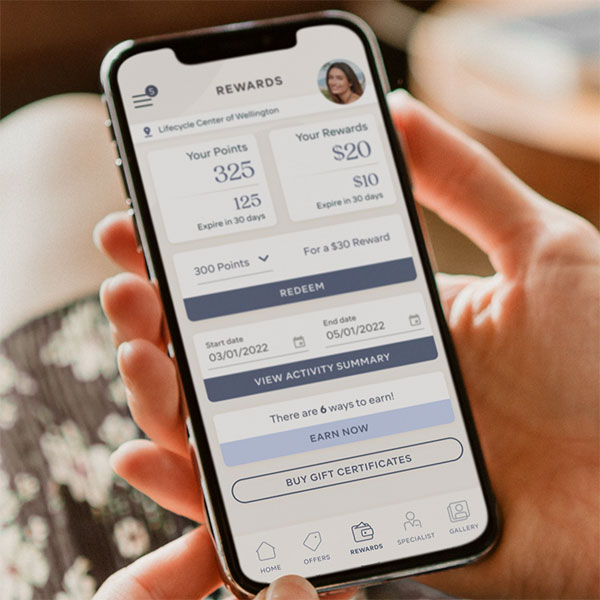 hand holding phone with Aspire Rewards app open to dashboard