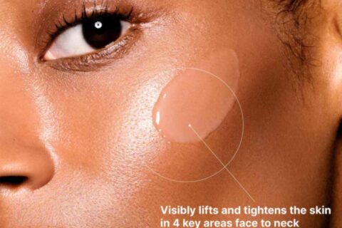 woman with skincare product on cheek